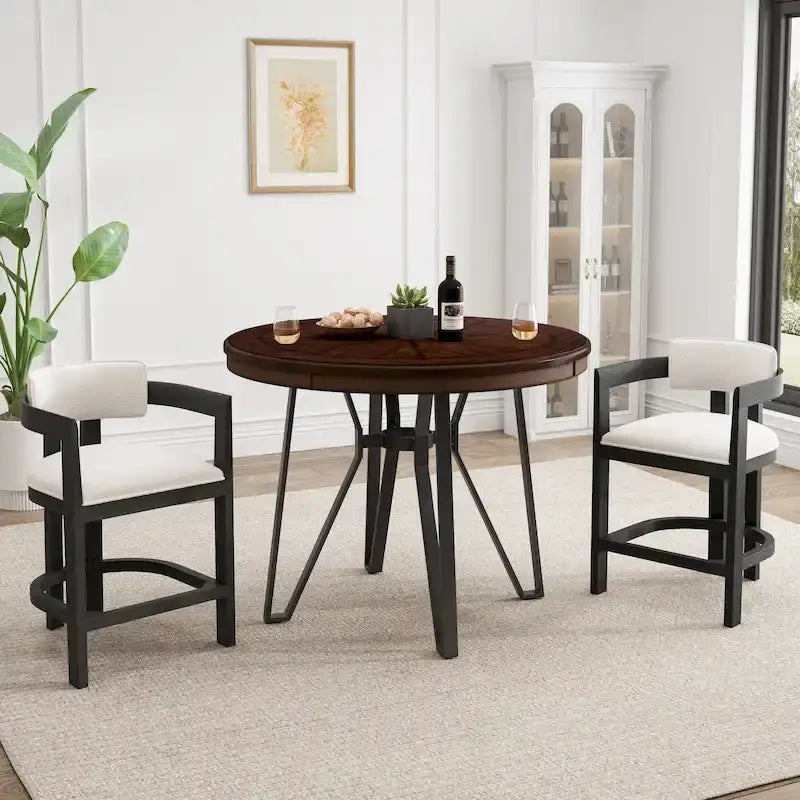 Three-piece bar stool set, featuring plush upholstered chairs and metal table legs.