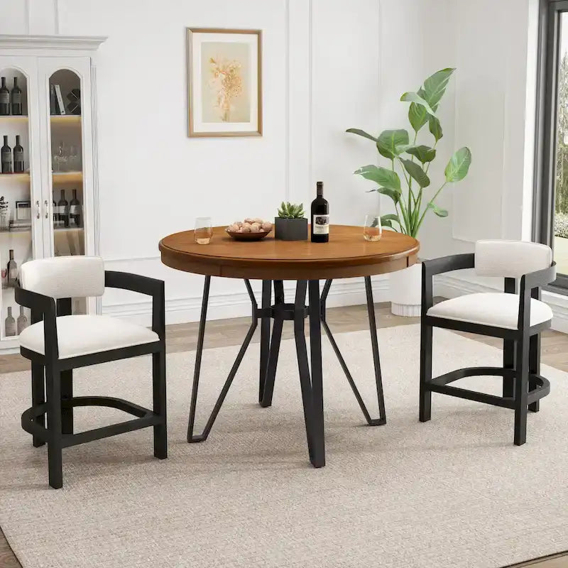 Three-piece bar stool set, featuring plush upholstered chairs and metal table legs.