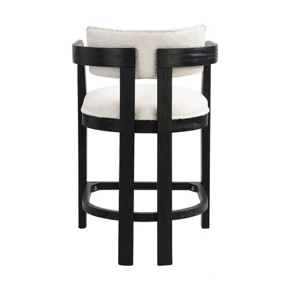 Three-piece bar stool set, featuring plush upholstered chairs and metal table legs.
