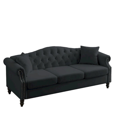 Made of black velvet, suitable for the living room. Three-seater sofa with tufted fabric, rolled-edge armrests, and studded details.